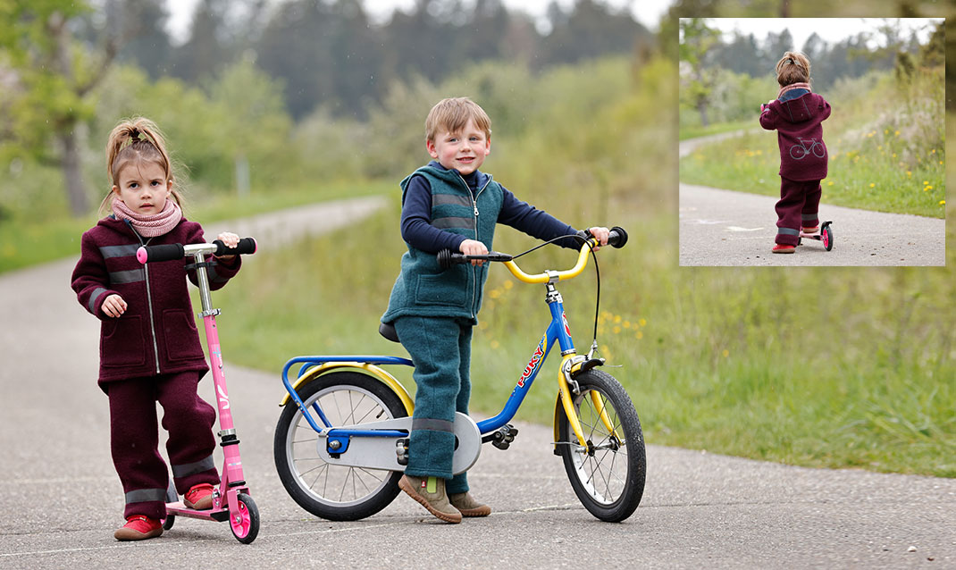 Kinder mit Roller und Fahrrad in Bio-Walkmode mit Reflektor-Applikationen